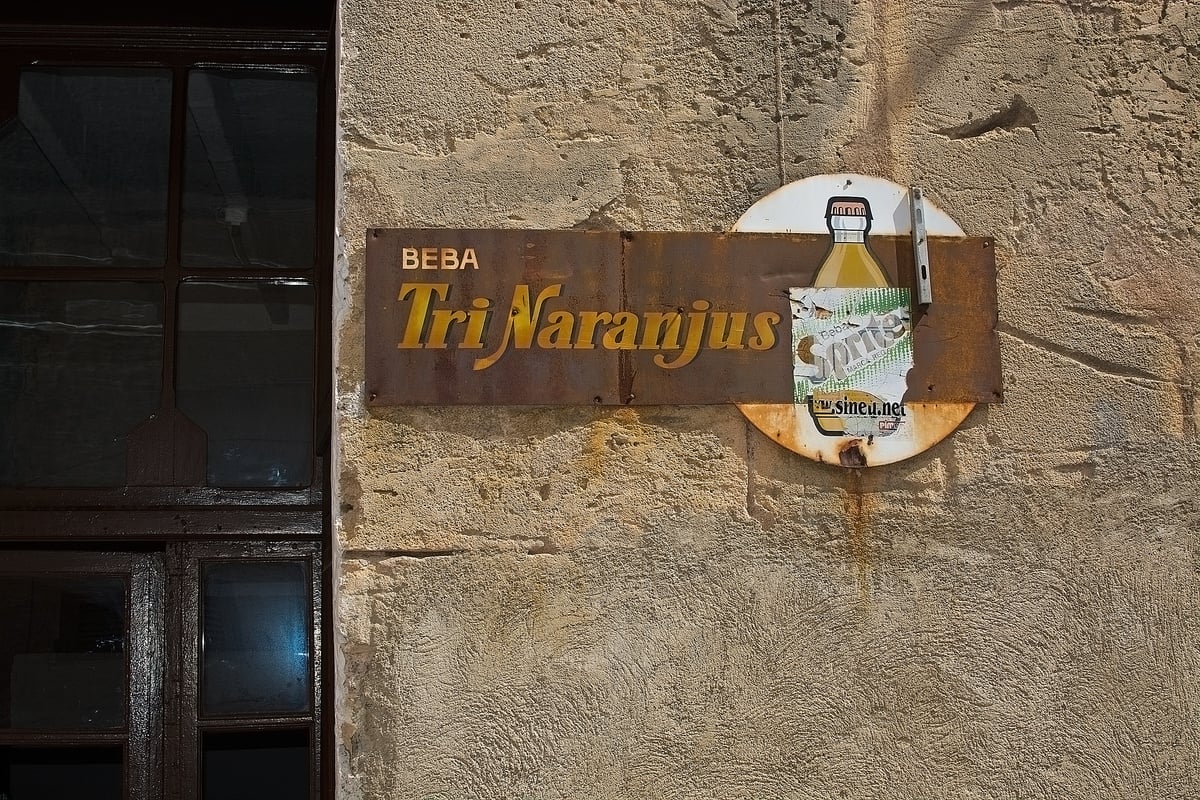 Retro Vintage Soda Drink Ad on Textured Grungy Stone Wall